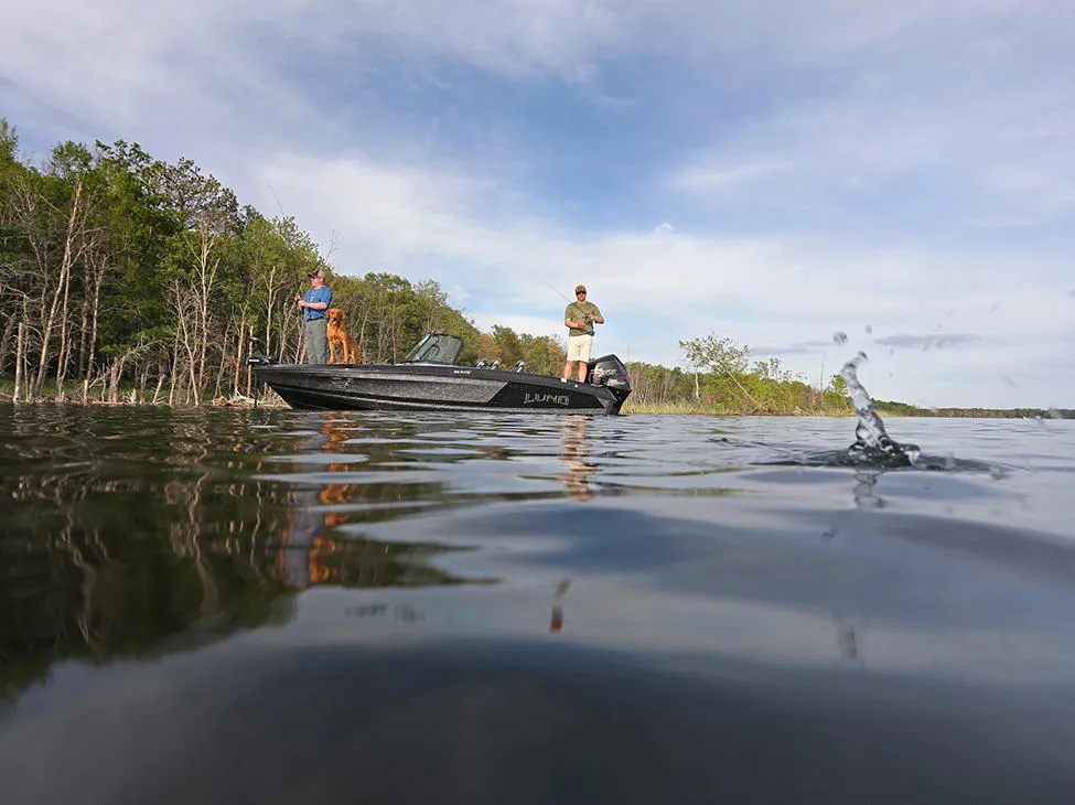 Two guys fishing over a boat