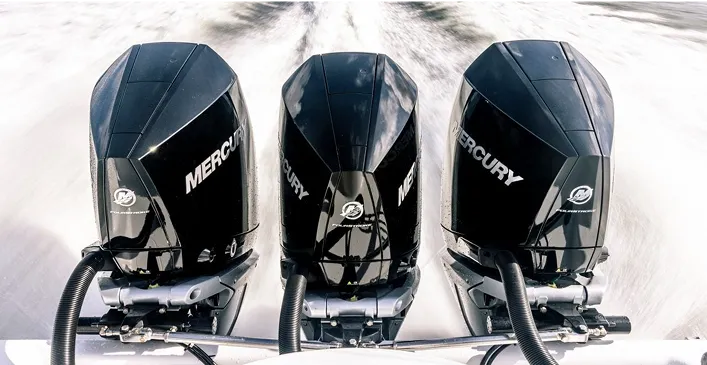 Three mercury motors going full speed at sea