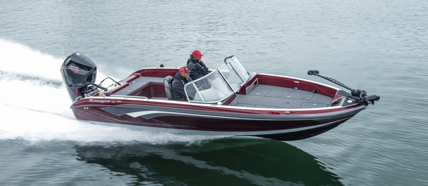 Ranger white boat going full speed with a couple on it on the sea